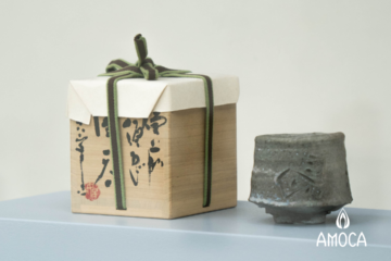 a ceramic box and a cup