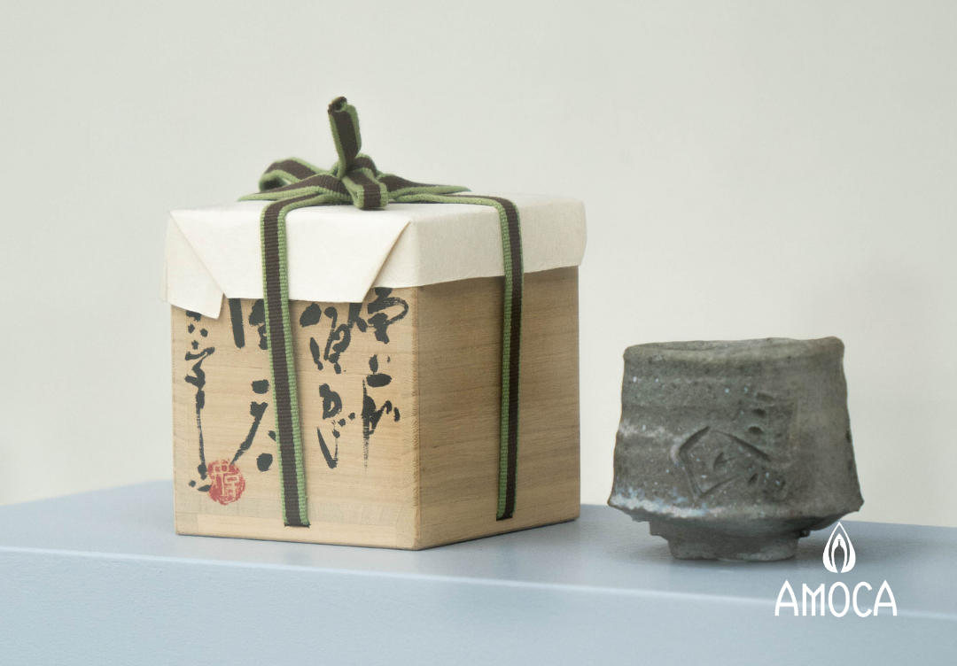 a ceramic box and a cup