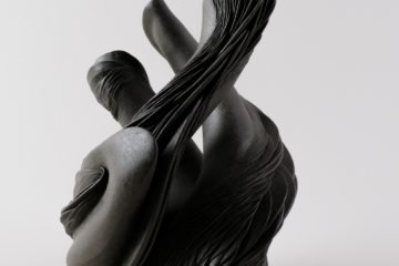 a black ceramic abstract sculpture